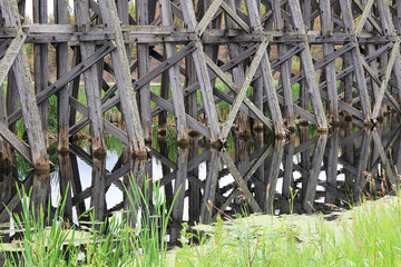 Closeup of a the wood work on an old trestle bridge