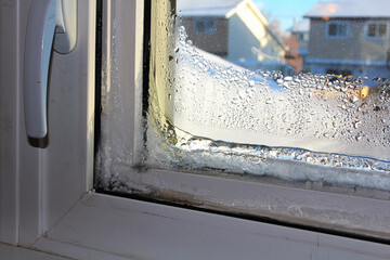 Closeup of a frozen window indoors in winter