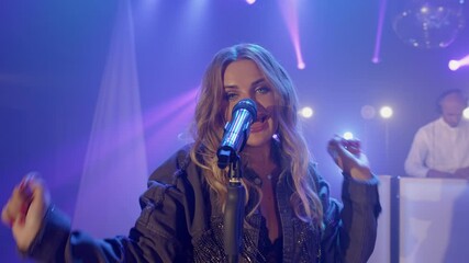 Musical group band of singer vocalist girl, dj man playing song performing on concert musician stage with lights. Party, music festival show concert. Actors dancing, singing at rehearsals. Slow motion - Powered by Adobe