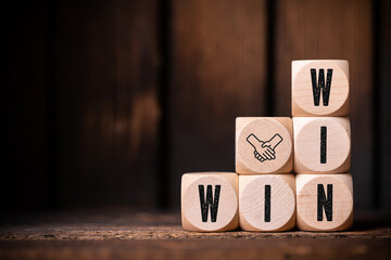 wooden cubes with message WIN WIN on wooden background