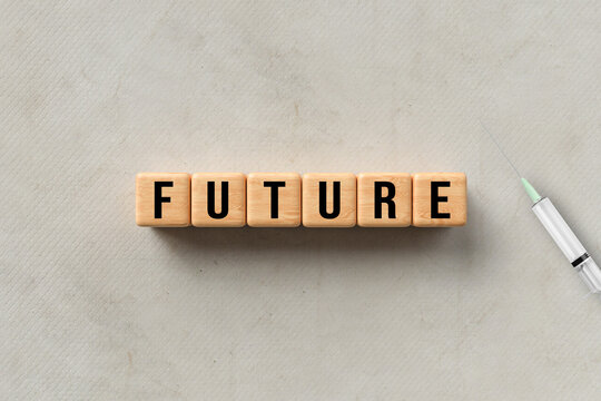 message FUTURE and a syringe on paper background
