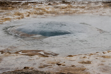 Strokkur Geyser forming blue bubble before erupting, Geysir, Iceland