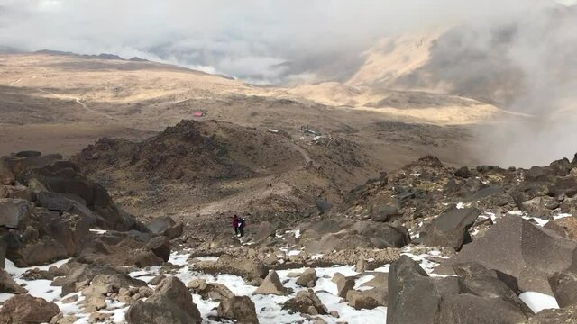 Mountaineer going down at Mount Savalan (Sabalan) Mountain House in Iran. Savalan is the third highest mountain in Iran. It&rsquo;s 4811 meters altitude.