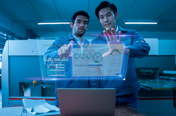 Industry 4.0 Robot concept .Engineers use laptop computers for machine maintenance, automation...