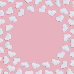 Fototapeta na wymiar Romantic frame from white hearts on pink fon. Holiday background for Valentines Day. Love concept. Plain colored. Minimal style.