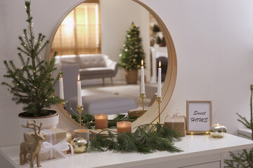 Mirror reflecting beautiful room with Christmas tree. Interior design