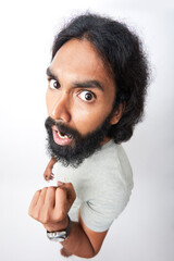 Shocked bearded young man portrait on white.