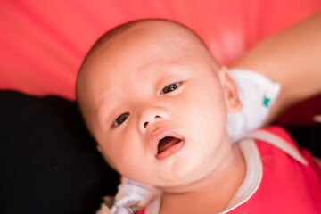 Portrait of new born baby boy resting in mothers arms,family concept,cose up.