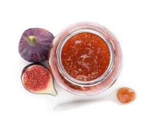 Delicious fig jam, fresh fruits and spoon on white background, top view
