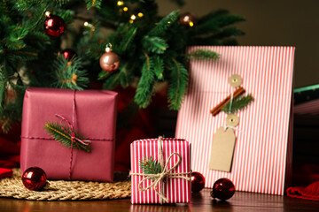 Fototapeta na wymiar Composition with beautifully wrapped gift boxes on wooden table