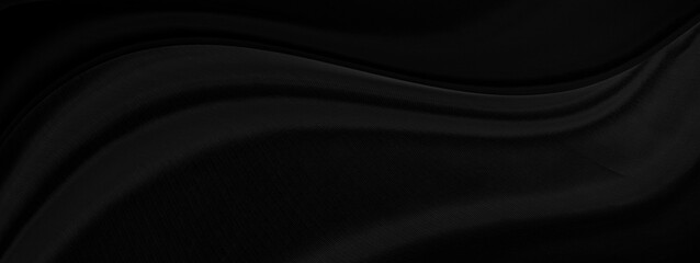Black gray satin dark fabric texture luxurious shiny that is abstract silk cloth background with patterns soft waves blur beautiful.