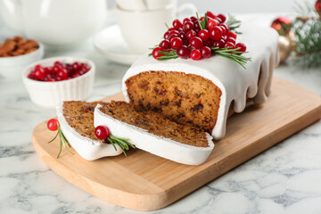 Traditional Christmas cake on white marble table. Classic recipe