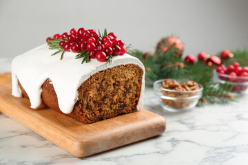 Traditional Christmas cake on white marble table. Classic recipe