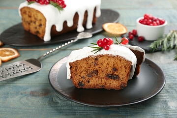Traditional Christmas cake on light blue wooden table. Classic recipe