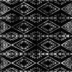 Geometric klim ikat pattern with grunge texture
