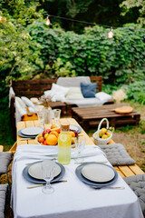 table served in the garden for a family dinner. a romantic dinner 
