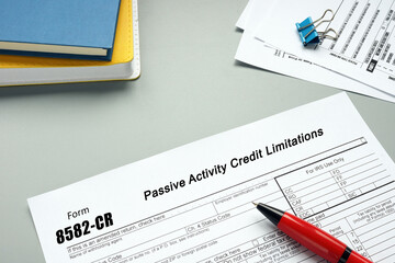 Business concept about Form 8582-CR Passive Activity Credit Limitations with phrase on the piece of paper.