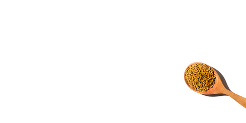 Fenugreek seeds spoon isolated on white background, benner. Grain of yellow tea Helba top view,...