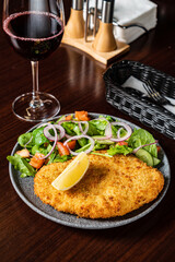 schnitzel with fresh sald and lemon
