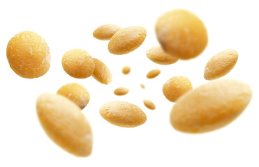Yellow lentils levitate on a white background
