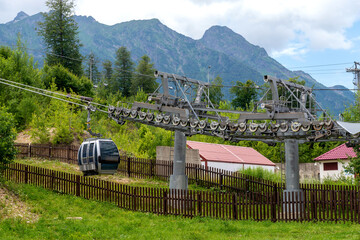 Cable car or cable railway in summer mountains