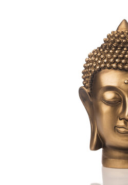 Brass Buddha head isolated on white.