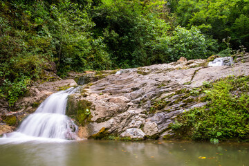 Fototapeta premium Orekhovsky Waterfall on Bezumenk's river - natural sight in the neighborhood of the city Sochi