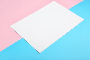 Blank paper sheet on color background