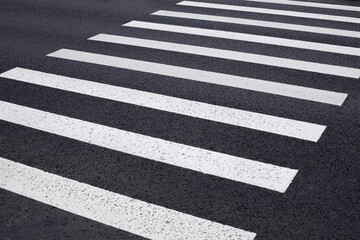 zebra crossing on the asphalt, white stripes, pedestrian crossing markings, safe road crossing