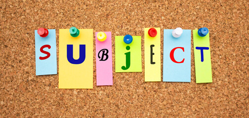 Color notes with letters pinned on a board. Word SUBJECT.