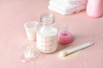 Fototapeta na wymiar Bottle of baby milk formula on color background