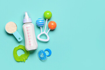 Bottle of baby milk formula and accessories on color background