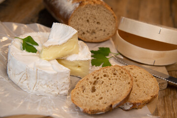 Camembert cheese on a wooden background, High quality photo