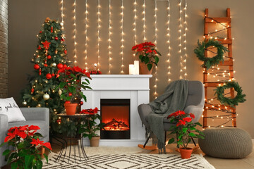 Interior of living room with fireplace decorated for Christmas