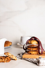 Christmas oatmeal cookies with a jute thread bow on a wooden background with ribbon