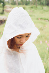 woman wear raincoat