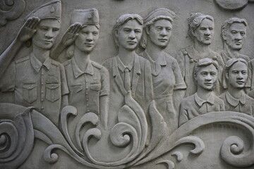 Cement sculpture tells the story of Thai people in the past.