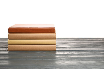 Old books on table against white background