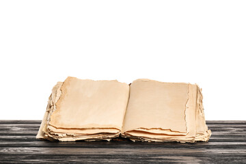 Open old book on table against white background