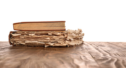 Old books on table against white background