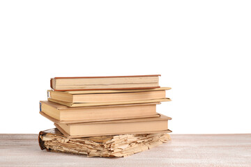 Old books on table against white background