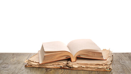 Old books on table against white background