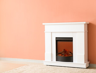 Beautiful fireplace near color wall in room