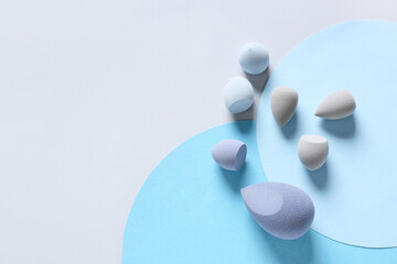 Makeup sponges on color background