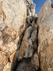 Rocky sea stones in the blue sky background, coast