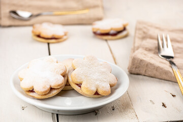 Traditional christmas cake Linzeraugen. Dessert is filled with jam and sprinkled with sugar. Ideal cakes for long term storage. In Slovakia called Linecky cake.