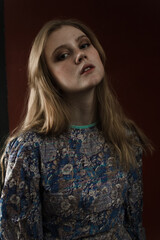 portrait of a young woman with blonde hair in dress