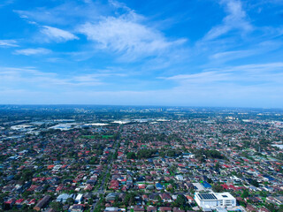 Panoramic Aerial View of Sydney Western suburbs showing house roof tops roads cars and other buildings 