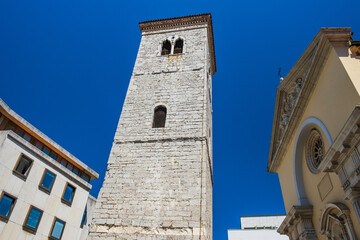 Fototapeta premium Old stone tower bell and church in city center of Rijeka, Croatia