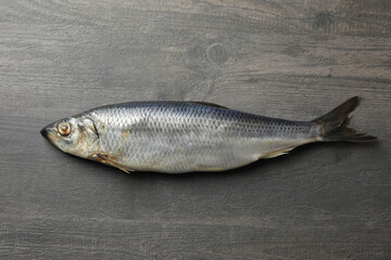 Fresh herring fish on gray wooden background